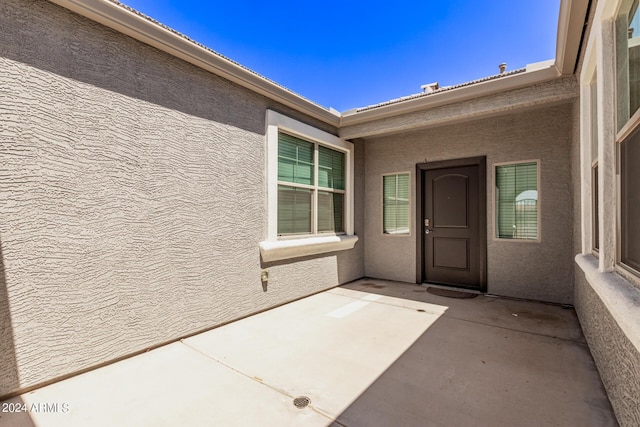 property entrance with a patio area