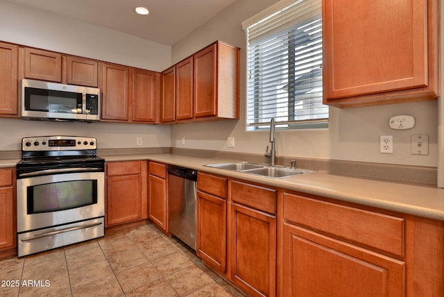 14870 W Encanto Blvd Unit 1038, Goodyear, AZ 85395 - kitchen with appliances with stainless steel finishes, light countertops, brown cabinets, and recessed lighting