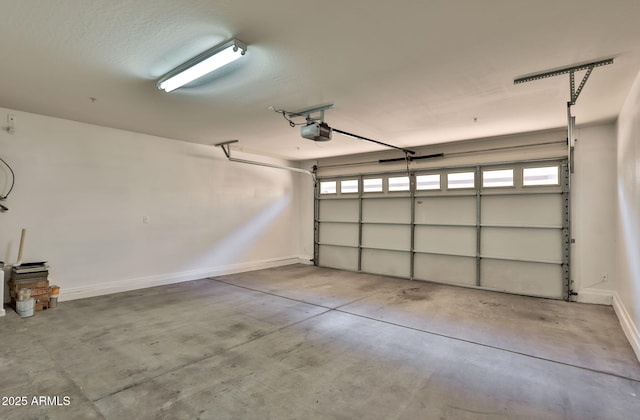 14870 W Encanto Blvd Unit 1038, Goodyear, AZ 85395 - garage featuring a garage door opener and baseboards