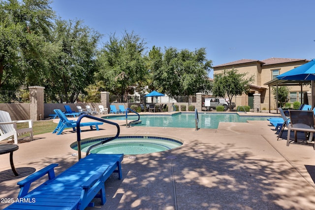 14870 W Encanto Blvd Unit 1038, Goodyear, AZ 85395 - community pool featuring a community hot tub and a patio