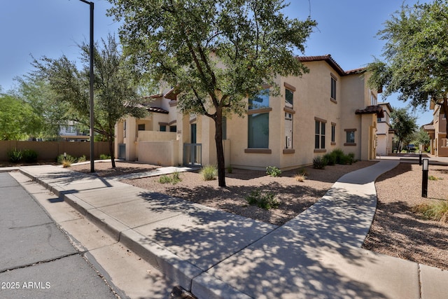 14870 W Encanto Blvd Unit 1038, Goodyear, AZ 85395 - mediterranean / spanish house featuring stucco siding and a tiled roof