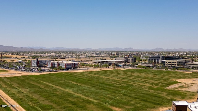 14870 W Encanto Blvd Unit 1038, Goodyear, AZ 85395 - view of green lawn featuring a mountain view
