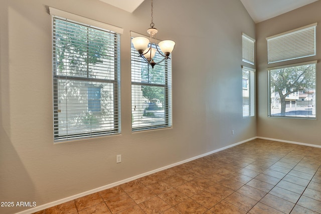 14870 W Encanto Blvd Unit 1038, Goodyear, AZ 85395 - tiled spare room with a chandelier and vaulted ceiling