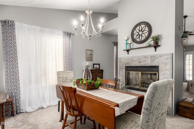 1214 W Sand Dune Dr, Gilbert, AZ 85233 - carpeted dining space featuring a chandelier, a fireplace, and vaulted ceiling