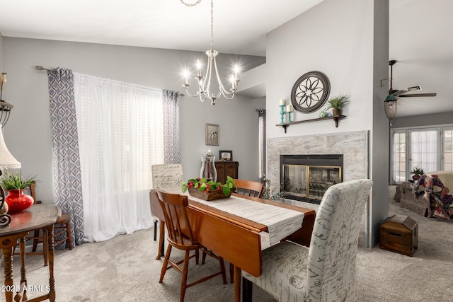 1214 W Sand Dune Dr, Gilbert, AZ 85233 - carpeted dining space with ceiling fan, a fireplace, a chandelier, and lofted ceiling