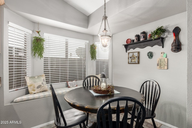 1214 W Sand Dune Dr, Gilbert, AZ 85233 - dining area with baseboards, vaulted ceiling, and a chandelier