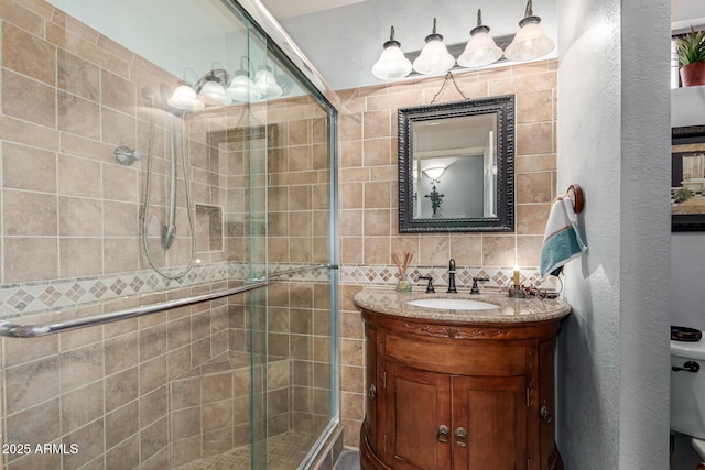 1214 W Sand Dune Dr, Gilbert, AZ 85233 - bathroom with a stall shower, vanity, toilet, and a textured wall