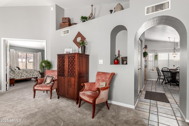 1214 W Sand Dune Dr, Gilbert, AZ 85233 - sitting room with baseboards, a towering ceiling, carpet flooring, and arched walkways