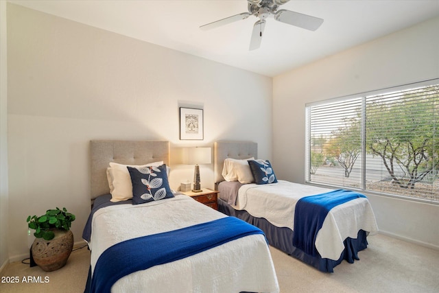 bedroom with carpet, baseboards, and a ceiling fan