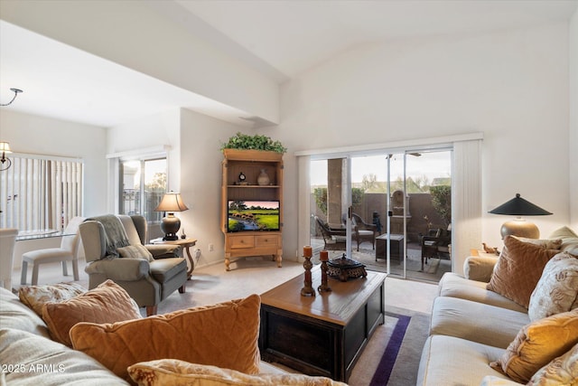 carpeted living room with vaulted ceiling