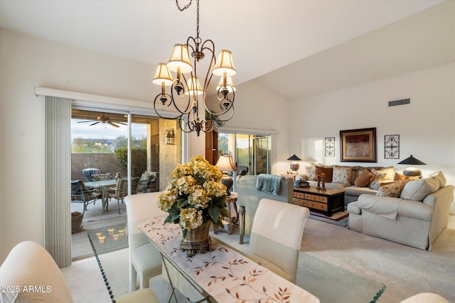 dining space featuring light carpet, lofted ceiling, visible vents, and an inviting chandelier