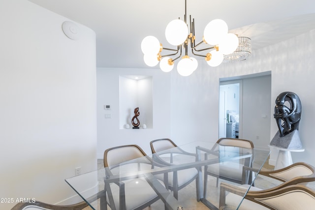 dining space featuring a notable chandelier