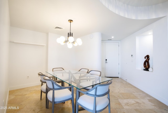 dining room featuring a notable chandelier