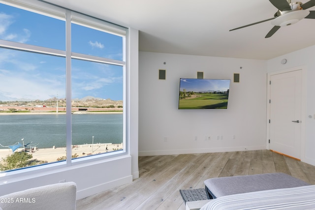 unfurnished bedroom with light wood-type flooring and ceiling fan