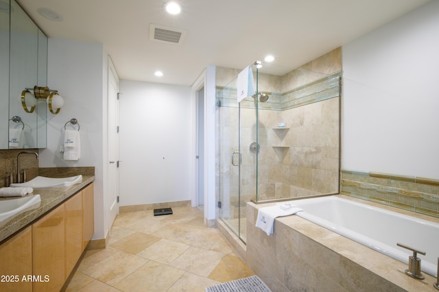 bathroom with plus walk in shower and vanity