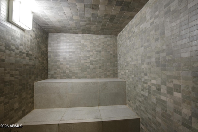 bathroom with tile walls