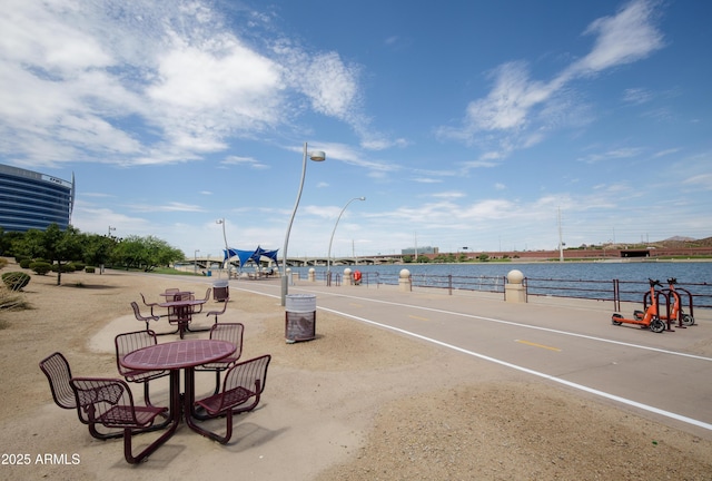 view of community with a water view