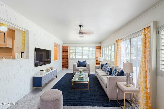 1945 E Solano Dr, Phoenix, AZ 85016 - living room with a ceiling fan, plenty of natural light, and ornamental molding