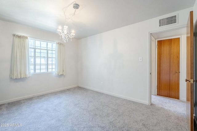1945 E Solano Dr, Phoenix, AZ 85016 - carpeted empty room with a chandelier and baseboards