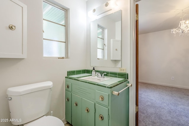 1945 E Solano Dr, Phoenix, AZ 85016 - bathroom with vanity and a chandelier