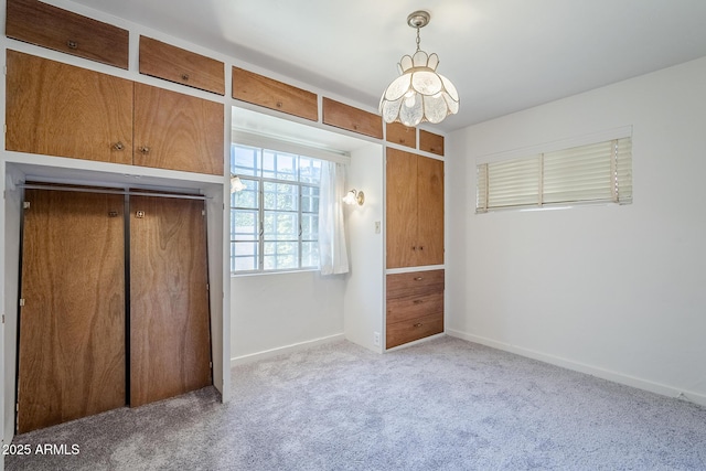 1945 E Solano Dr, Phoenix, AZ 85016 - unfurnished bedroom with carpet floors, a chandelier, and a closet