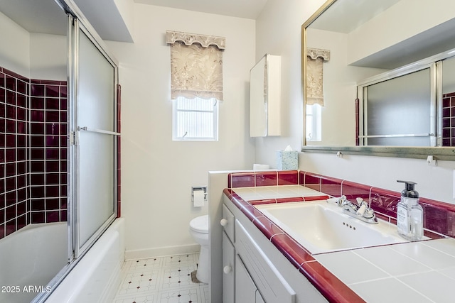 1945 E Solano Dr, Phoenix, AZ 85016 - full bathroom with vanity, shower / bath combination with glass door, and tile patterned floors