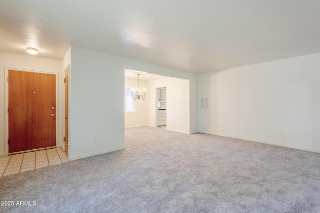 1945 E Solano Dr, Phoenix, AZ 85016 - unfurnished room with carpet, a chandelier, and tile patterned floors