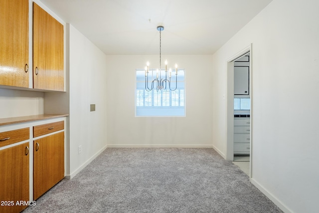 1945 E Solano Dr, Phoenix, AZ 85016 - unfurnished dining area featuring light carpet and a chandelier