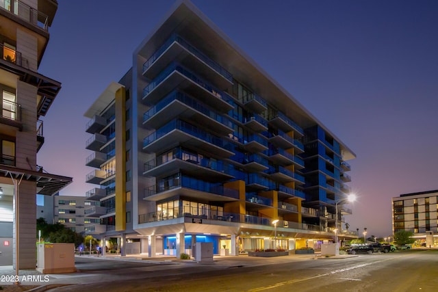 view of outdoor building at dusk