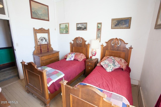 bedroom featuring wood-type flooring