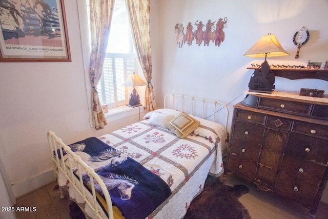 bedroom featuring hardwood / wood-style floors