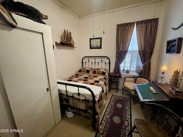 bedroom featuring crown molding and hardwood / wood-style floors