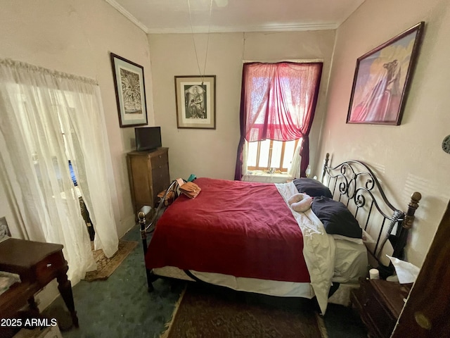 carpeted bedroom featuring crown molding