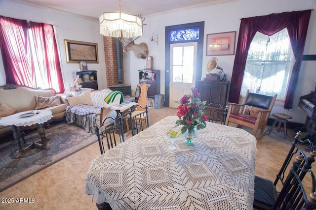 dining area featuring a notable chandelier and crown molding