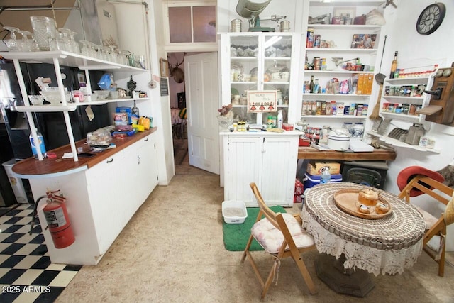 interior space featuring white cabinetry