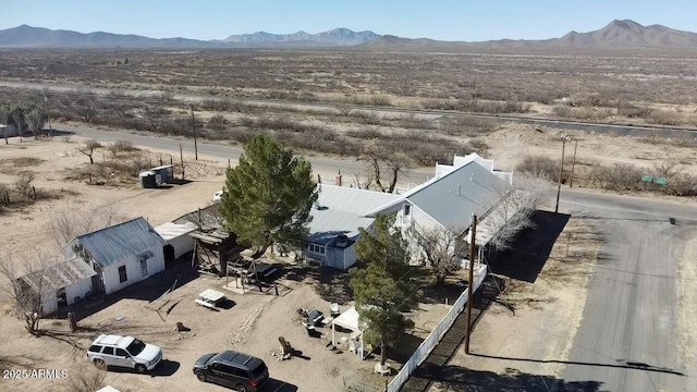 birds eye view of property featuring a mountain view