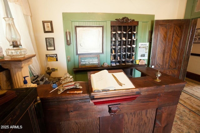 bar with hardwood / wood-style flooring