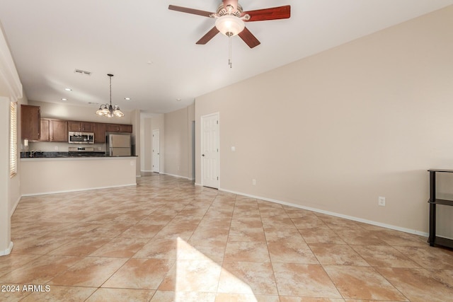 805 W Sunset Dr, Coolidge, AZ 85128 - unfurnished living room featuring ceiling fan with notable chandelier