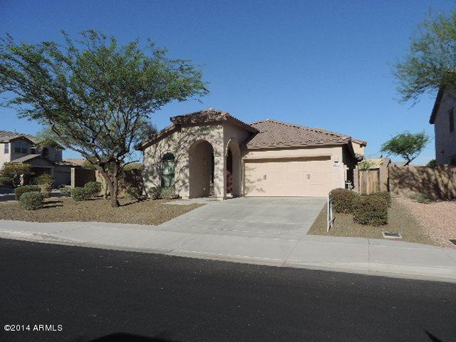29673 N 120th Ln, Peoria, AZ 85383 - view of front facade with driveway, a garage, a tiled roof, fence, and stucco siding