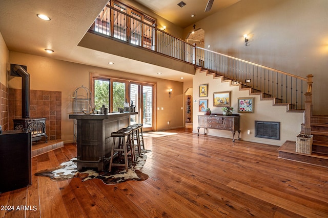 2946 N Lodgepole Rd, Overgaard, AZ 85933 - living room featuring hardwood / wood-style flooring, stairway, baseboards, a towering ceiling, and recessed lighting