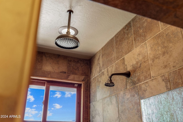 interior details featuring a textured ceiling