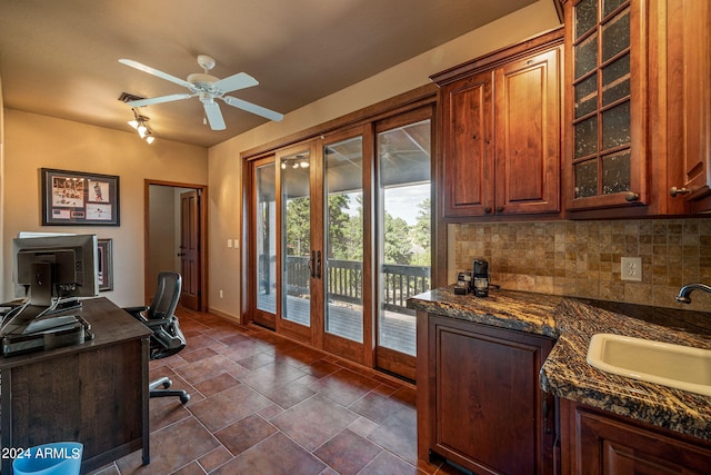 office area with ceiling fan and sink