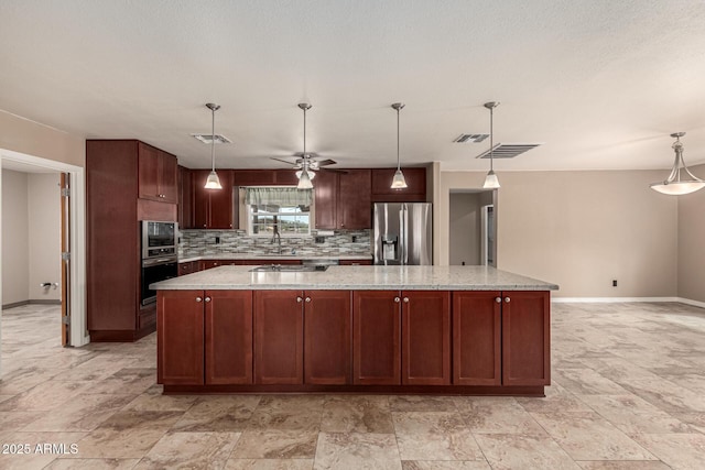 kitchen with a large island, visible vents, tasteful backsplash, and stainless steel fridge with ice dispenser