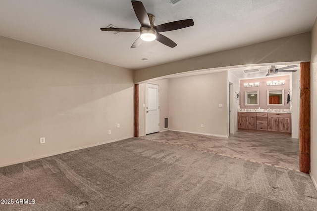 unfurnished bedroom featuring carpet flooring, baseboards, and connected bathroom