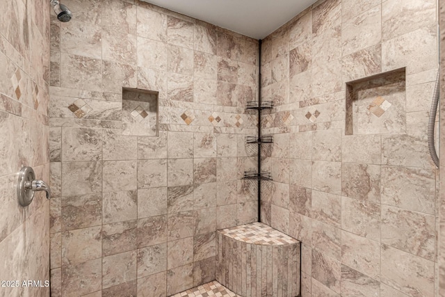 full bathroom featuring tiled shower