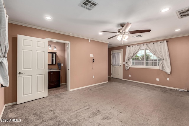 spare room with visible vents, baseboards, and carpet floors