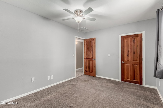 spare room with visible vents, baseboards, ceiling fan, and carpet flooring