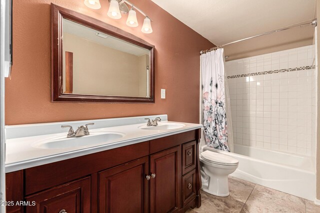 bathroom with a sink, toilet, double vanity, and shower / tub combo