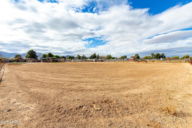 view of yard with a rural view