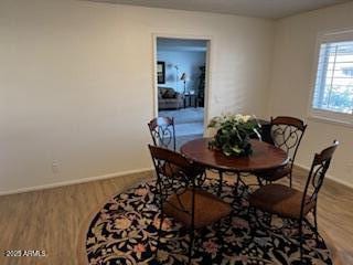 dining space featuring hardwood / wood-style floors